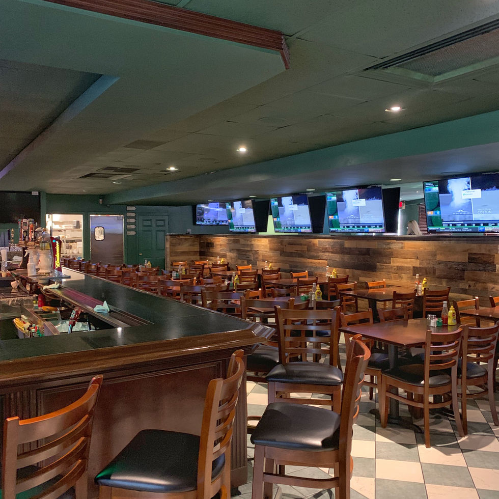 Long wooden bar top with stools and tap handles